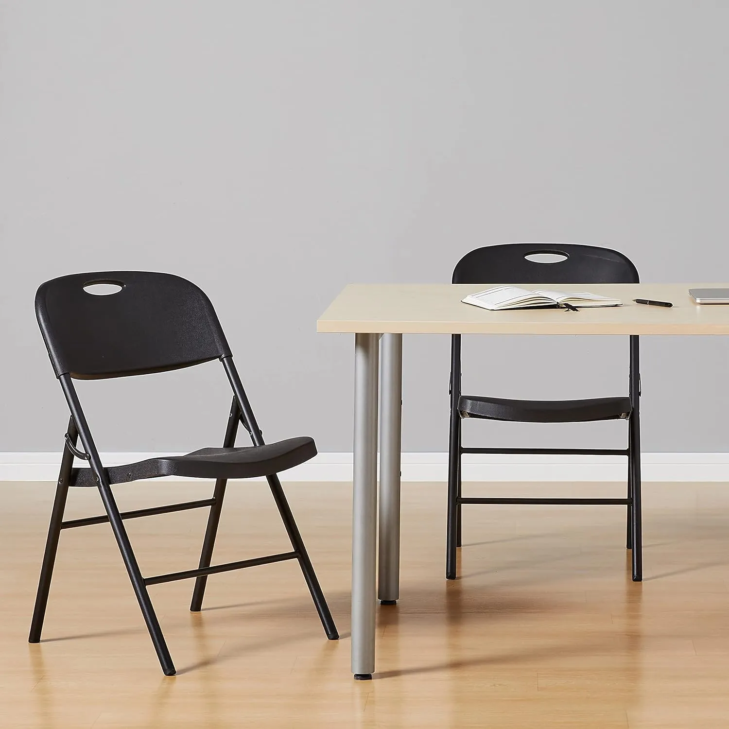 Amazon Basics Foldable Portable Sturdy Folding Plastic Chair, 350-Pound Capacity, Black, 2-Pack